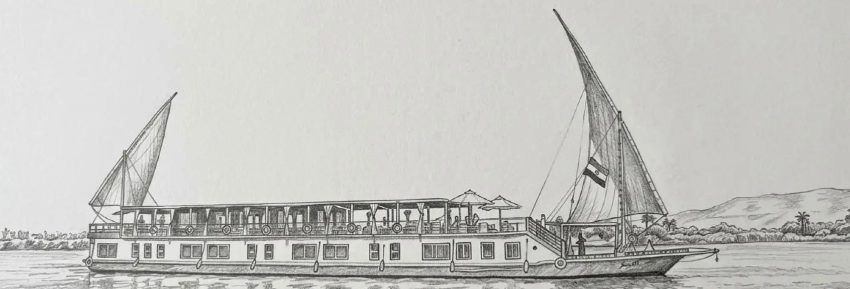 An elegant traditional white Dahabiya boat sailing gracefully on the Nile River during a luxury Egyptian cruise journey.