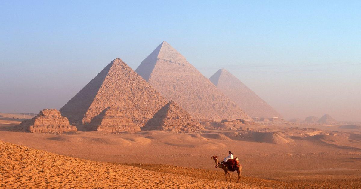 A family enjoying an 8-day family adventure in Egypt with MSM Travel Egypt at the Giza Pyramids.