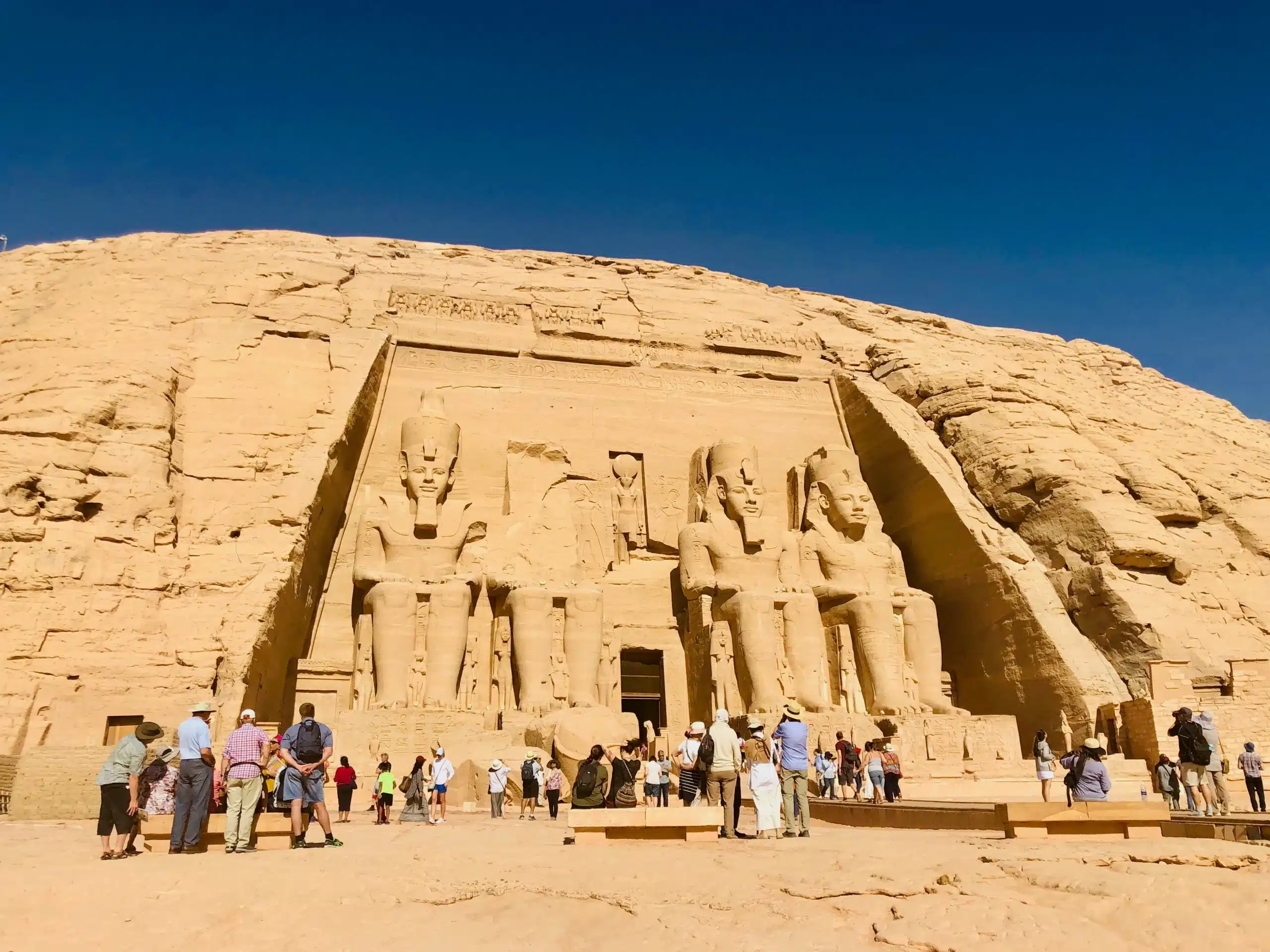 Two-day Aswan and Abu Simbel private tour showing the colossal statues of Ramses II at the entrance of the Great Temple in Egypt.