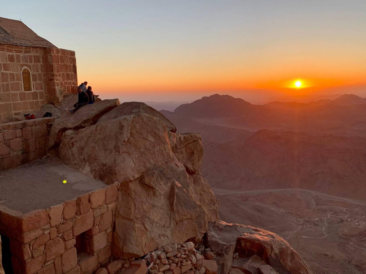 The sunrise over the rugged peaks of Mount Sinai during a guided trekking tour from Sharm El-Sheikh.