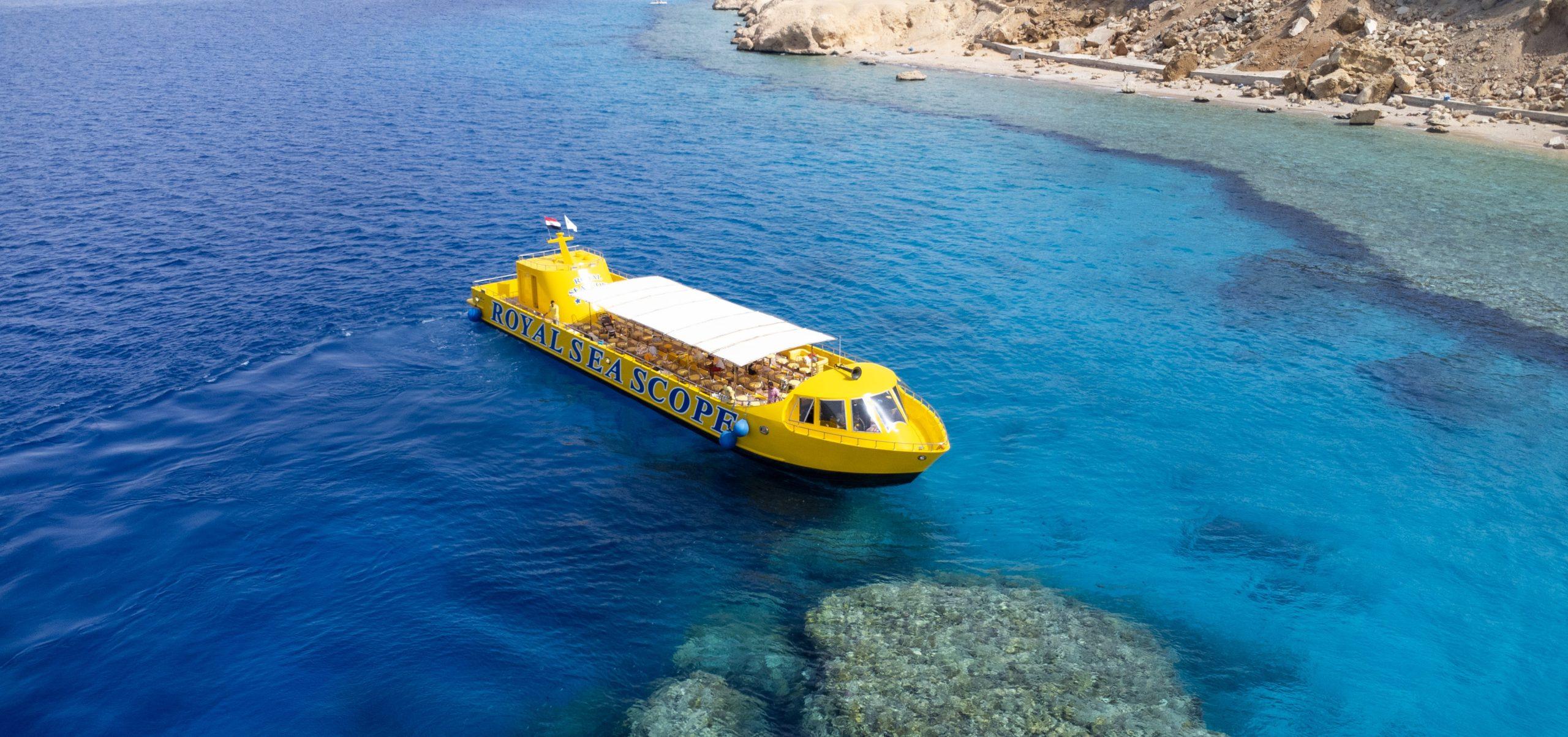 The Royal Seascope semi-submarine in Sharm El Sheikh showing tourists viewing coral reefs through large underwater windows.