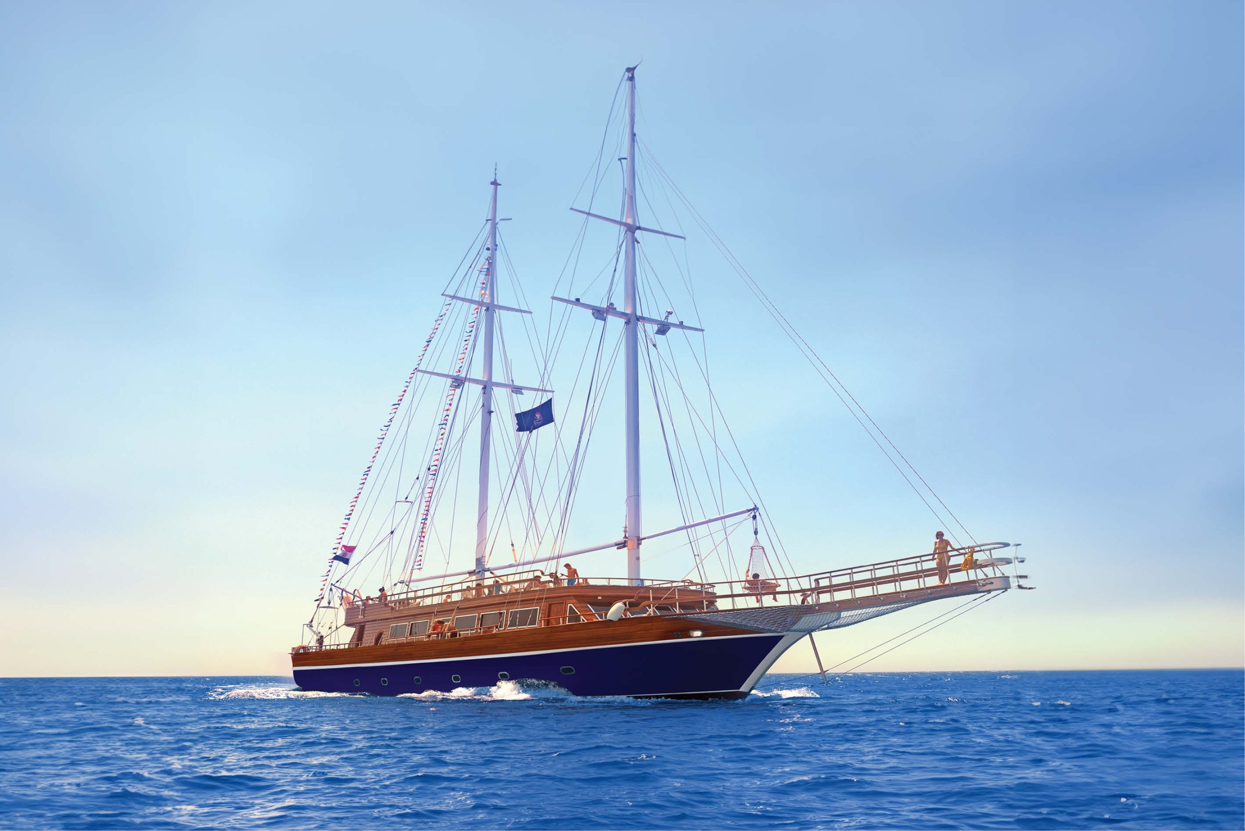 Pirates Sailing Boat cruising the Red Sea near Hurghada with passengers enjoying snorkeling and sunbathing.