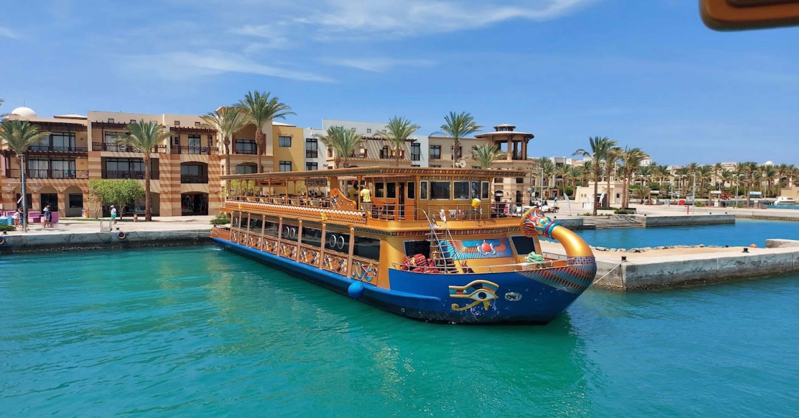 Luxury Nefertari Boat sailing on the Red Sea with clear waters and coral reefs.