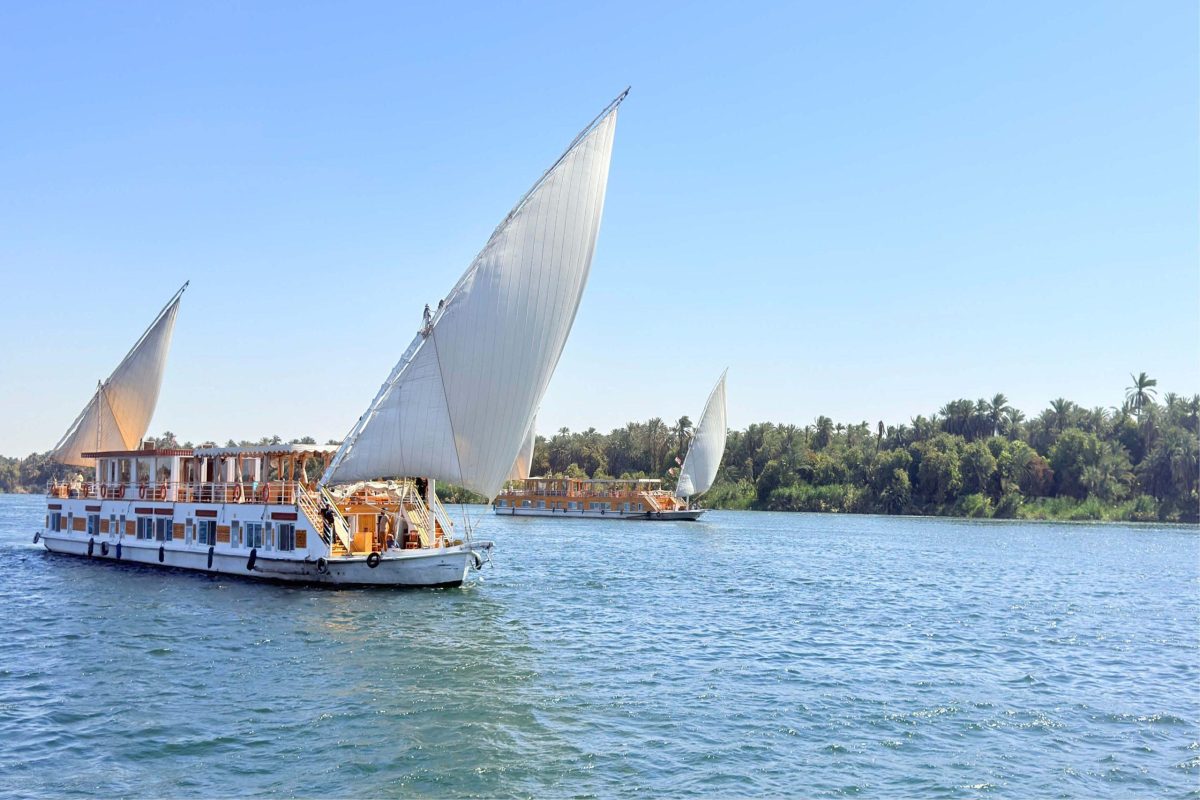 Dahabiya Nile cruise sailing along the Egyptian river with scenic views of temples and desert landscapes