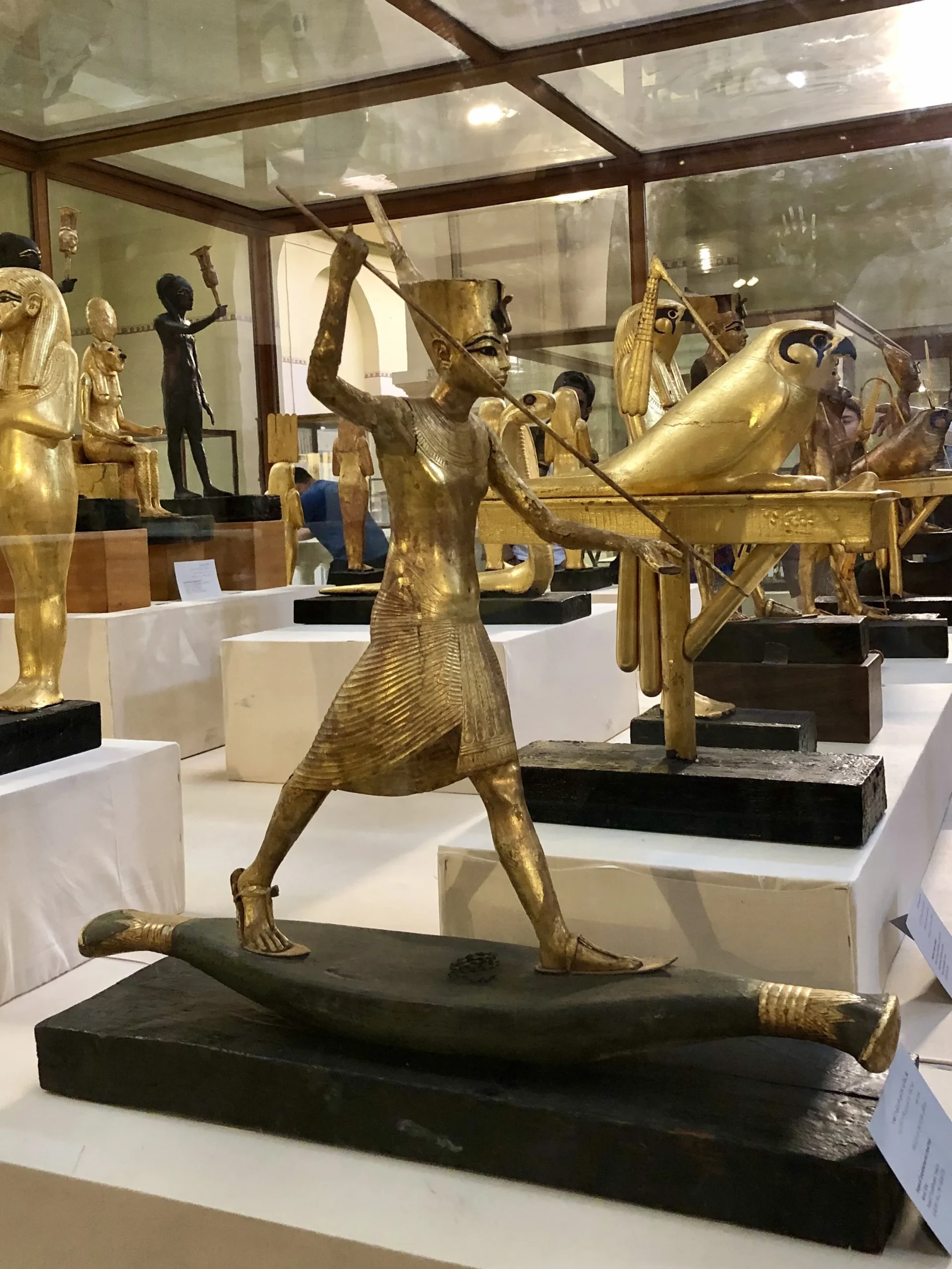 Tourists exploring the Pyramids of Giza with the Great Sphinx in the background.
