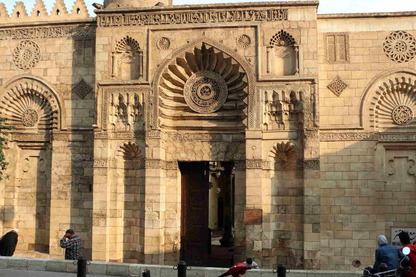 Exterior façade of Al Aqmar Mosque in Cairo, Egypt showcasing Fatimid architecture and intricate carvings