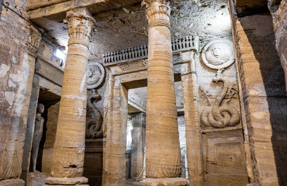 Interior of the Catacombs of Kom el Shoqafa in Alexandria showing the Roman-Egyptian burial chamber and carved pillars.