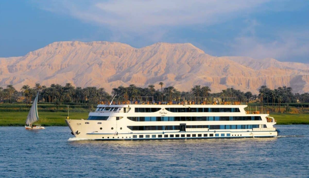 A luxury Nile cruise boat sailing past ancient temples in Egypt for MSM Travel Egypt guide