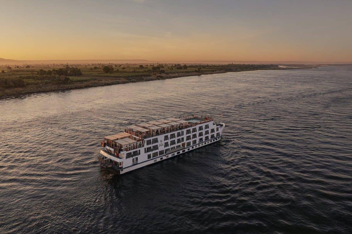 A luxury Dahabiya sailing boat on the Nile River in Egypt during sunset, representing a premium MSM Travel Egypt cruise experience.