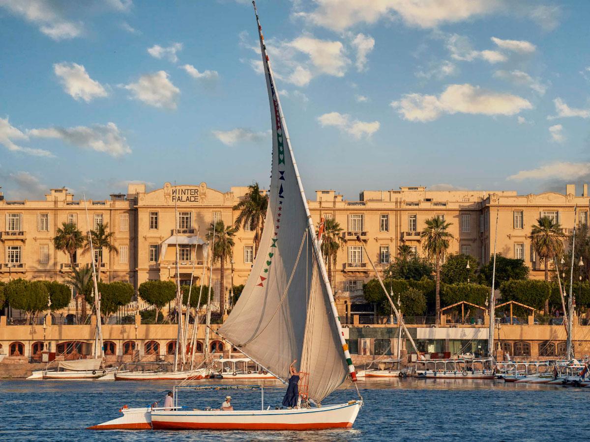 Traditional felucca boat sailing on the Nile River in Luxor, Egypt