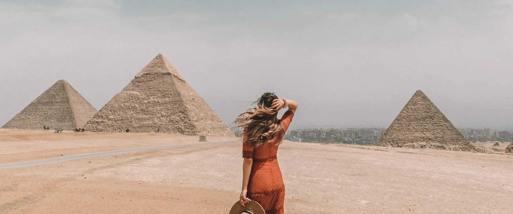 Private Giza Pyramids tour guide showing travelers the Great Pyramid of Khufu in Cairo Egypt