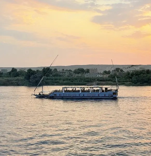Traditional luxury Dahabiya wooden boat sailing on the Nile River