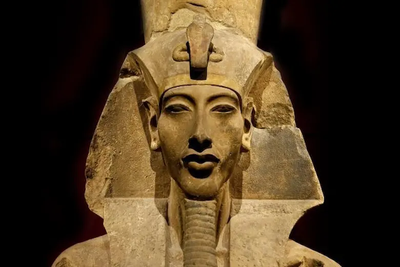 Statue bust of Pharaoh Akhenaten showcasing the distinct Amarna period art style.