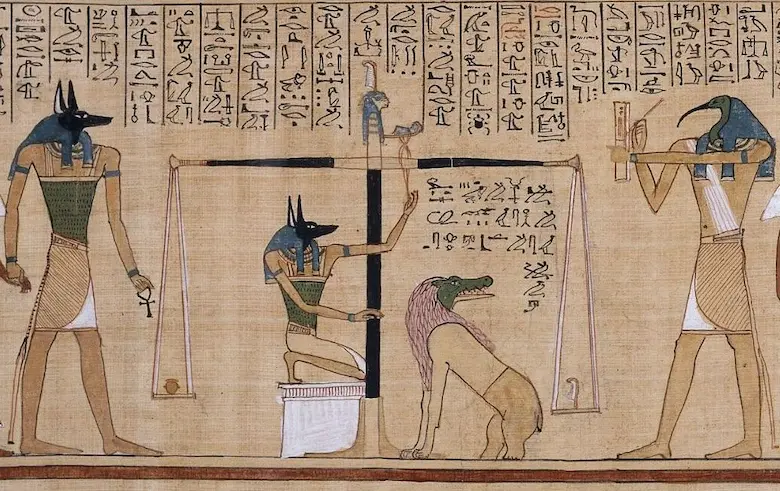 Ancient Egyptian beliefs about the afterlife depicted in a Book of the Dead papyrus showing Anubis weighing a heart against Ma'at's feather with Thoth.