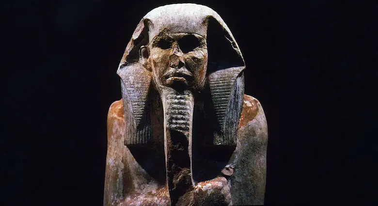 Limestone statue of King Djoser wearing the Nemes headcloth and ceremonial beard
