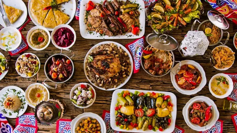 Popular Egyptian dishes from Cairo, Luxor, Aswan, and Alexandria served on a dining table.